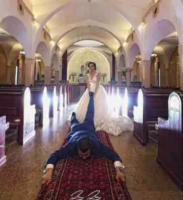 Photo Of A Bride Dragging Her Man On The Floor